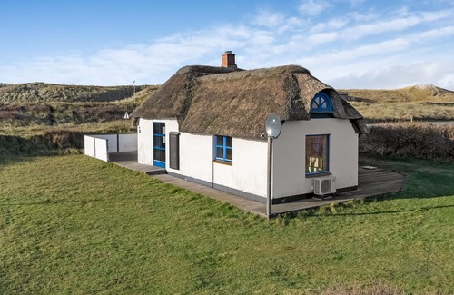 Fjand Badeby House | This thatched cottage is situated on a beautiful nature plot in Fjand.