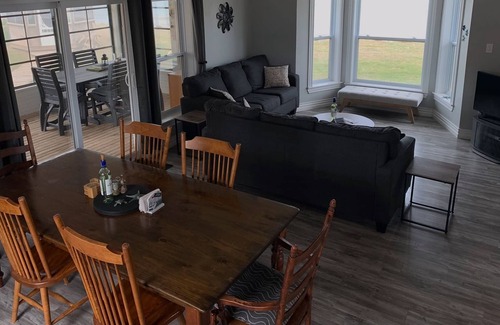 French Village House | Three Bedroom Home With Screened In Porch Only Steps Away From North Shore Beach