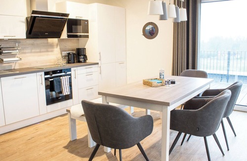 Butjadingen Apartment | Time out at Sielhuus - penthouse with a view. Sauna. Roof terrace. Exclusive.