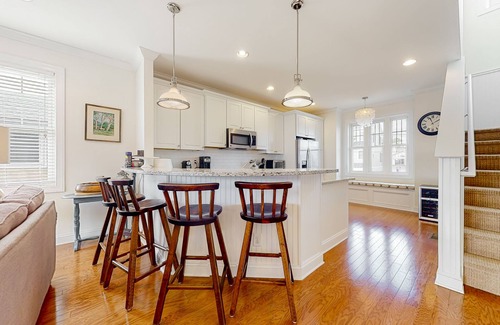 South Bethany Harbor House | Town of South Bethany canal-front home with 2 balconies, firepit, & kayaks