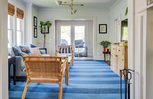 Quogue House | Traditional-style home with private pool, several sitting rooms, back deck,...