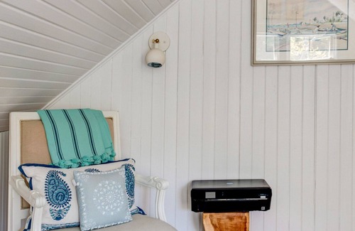 Quogue House | Traditional-style home with private pool, several sitting rooms, back deck,...