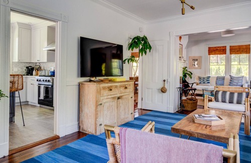 Quogue House | Traditional-style home with private pool, several sitting rooms, back deck,...