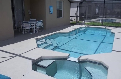 Sunset Ridge House | Treat Yourself with Private Pool at Sunset Ridge Davenport 5BR 3BA by RedAwning