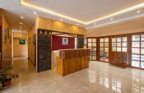 Shoghi Hotel | Treebo Lords Garden Glory
