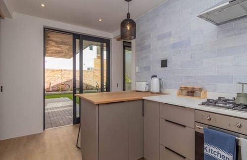 Voelklip House | Trendy family home, bright, mountain views & pool