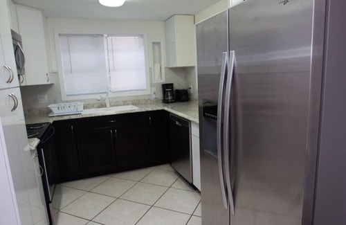 Mango Groves Cottage | Tropical Heated Pool home in fun beach side town Sleeps 8 Private