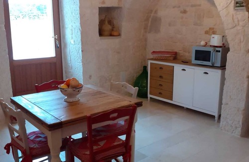 Alberobello House | Trullo surrounded by nature with a beautiful view a stone's throw from the center