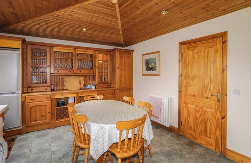 Newcastle Cottage | TUDOR LODGE, pet friendly, with a garden in Newcastle, County Down