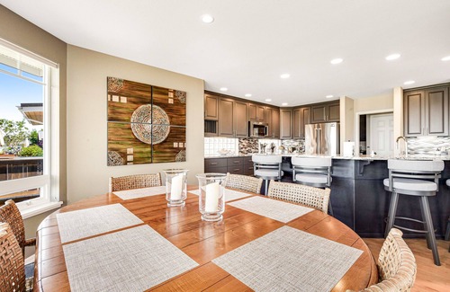 Freeland House | Two-story, bay front retreat with a deck, direct beach access, and washer/dryer
