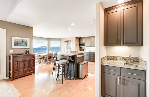 Freeland House | Two-story, bay front retreat with a deck, direct beach access, and washer/dryer
