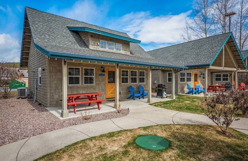 Dover Bay House | Unwind at Fish Tales Bungalow, a charming coastal-style hideaway just steps from the lake. Enjoy resort amenities, trails, and the tranquil Dover Bay setting.