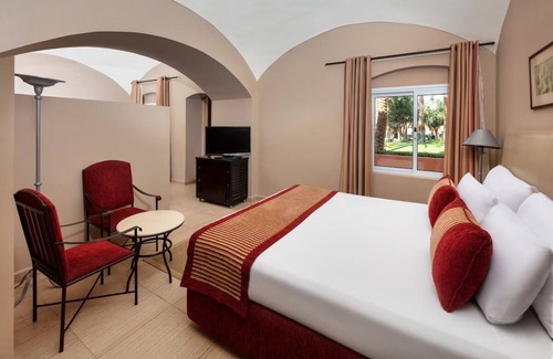 Makadi Bay Resort | Unwind in a Comfortable Room with Pool and Easy Beach Access Nearby