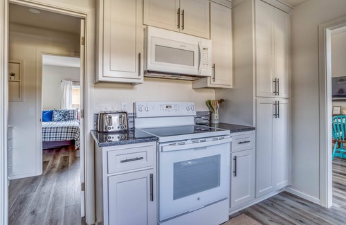 Bay City House | Updated Bay City Home Has Sunny Great Room, Fenced Yard, Deck, and Game Room!