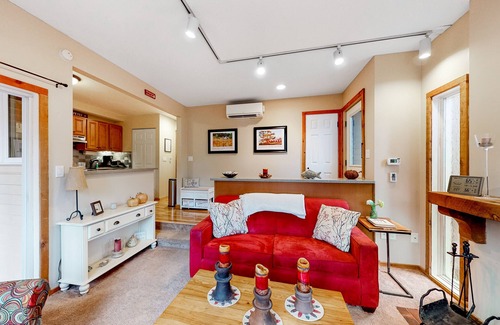 Maple City Condo | Updated, charming condo near Lake Michigan with porch, washer/dryer, fireplace