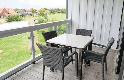 Wremen Apartment | Vacation apartment near the beach with sauna & beautiful, covered balcony with dyke view