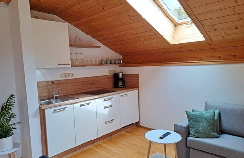 Aschau im Chiemgau Apartment | Vacation apartment Göttersberg 38 sqm, separate bedroom, living room with open kitchen and west-facing balcony
