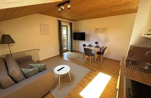 Aschau im Chiemgau Apartment | Vacation apartment Göttersberg 38 sqm, separate bedroom, living room with open kitchen and west-facing balcony