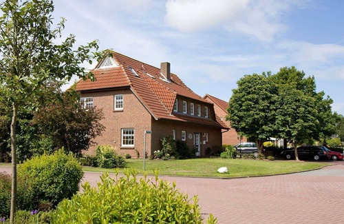 Werdum Apartment | Vacation apartment Schmetterling - Haus am Brunnen
