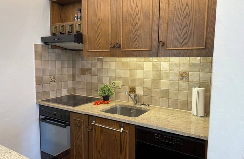 Gordola Apartment | Vacation apartment with panoramic view and outdoor pool, garden seating area and sunbathing lawn