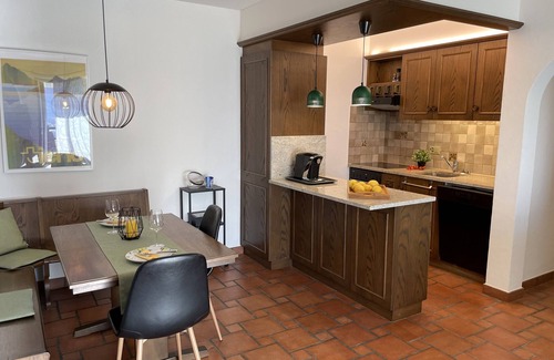 Gordola Apartment | Vacation apartment with panoramic view and outdoor pool, garden seating area and sunbathing lawn