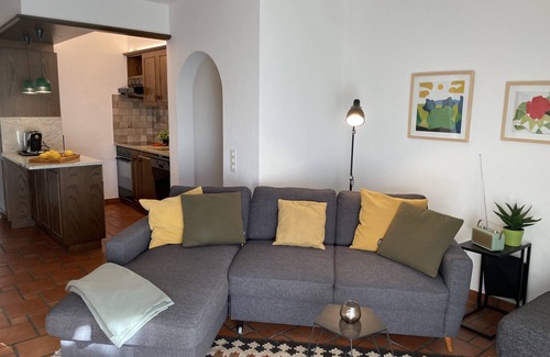 Gordola Apartment | Vacation apartment with panoramic view and outdoor pool, garden seating area and sunbathing lawn