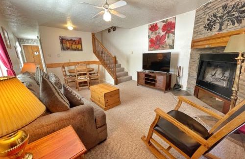 Red River House | Valley Condo 101 Creekside - End Unit - Wi-Fi - Hot Tub - Fireplace - Washer - Dryer - Playground