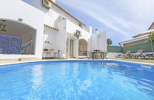 Quarteira Villa | Vilamoura: Retreat with Heatable Pool & BBQ