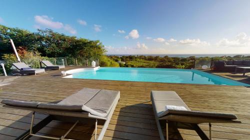 Saint-Francois Villa | Villa Deluxe l'Hacienda Villa vue mer 180 piscine jacuzzi proche plage marina golf pointe des châteaux et casino jardin clos voyage durable