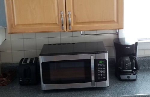 Kill Devil Hills House | Vintage beach bungalow. Steps to beach! Bring your dog!