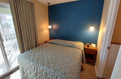 Belle Vista Resort | Walk out to the Beach from your 2 Bedroom Condo or swim in the pool. Sleeps 6
