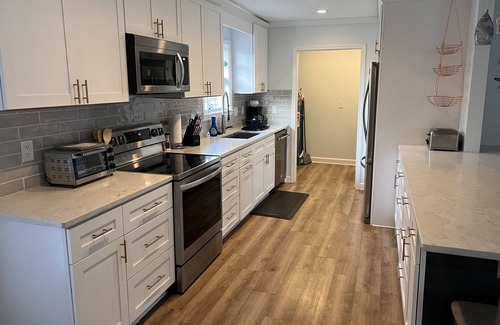 Myrtle Grove House | Walking distance to the ICW, mancave with a pool table and outdoor kitchen.
