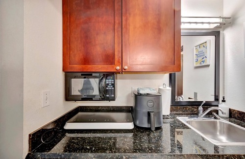 Ruskin Apartment | Watch the dolphins! Large balcony Suite and heated pool!