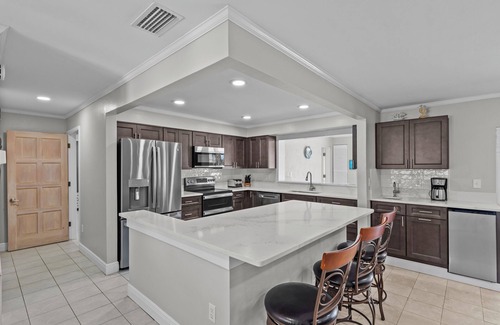 Gulf Harbors House | Water Front Home with Heated Pool & Hot Tub, 2 Master Suites & a Floating Dock