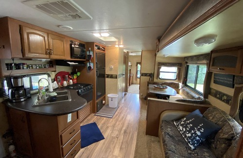 Riverwood RV Rental | Water Front Tracer RV by Glampers Camp