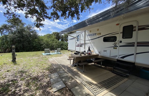 Riverwood RV Rental | Water Front Tracer RV by Glampers Camp