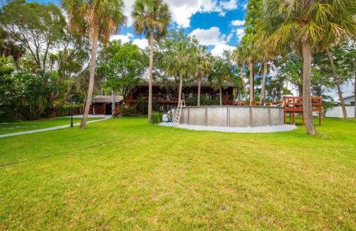 Riverview House | Waterfront 6BR Oasis with Pool, Gym, and Huge Dock