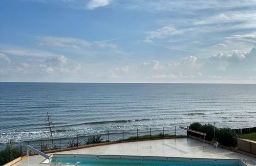 San-Nicolao Apartment | Waterfront apartment with pool and private beach access.