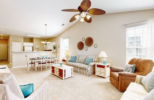Sunset Beach Condo | Waterfront condo with pool, tennis, bikes & lagoon/golf views - near the beach