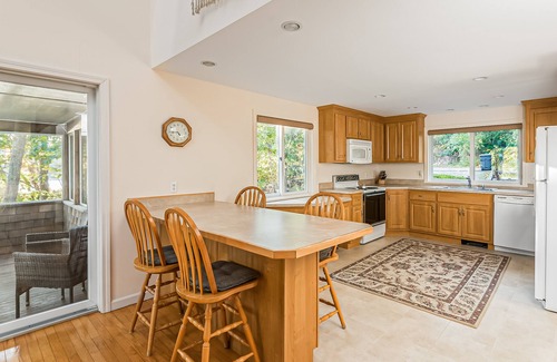 South Chatham House | Waterfront home with lovely lake views, great deck, sun porch & fireplace