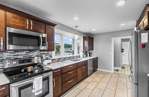 Fairhaven House | Waterfront Oasis with day beds and hot tub with captivating sunsets.