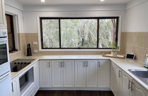 Dora Creek House | Waterfront Paradise with Jetty, Kayaks, BBQ, & more