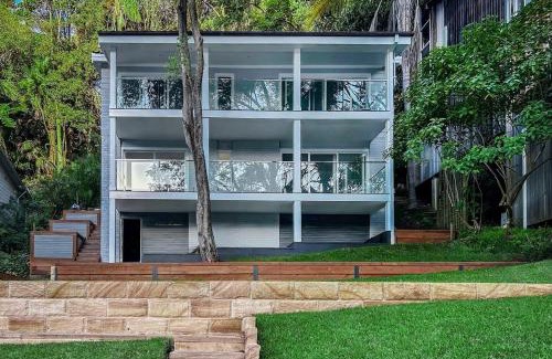 Church Point House | Waterside Retreat with Hillside House and Boathouse in Church Point