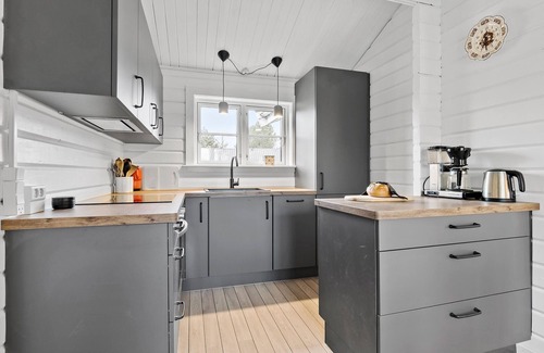 Skibby House | Welcome to this cozy wooden holiday home for a wonderful vacation.