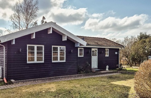 Skibby House | Welcome to this cozy wooden holiday home for a wonderful vacation.