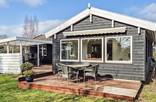 Skibby House | Welcome to this cozy wooden holiday home for a wonderful vacation.