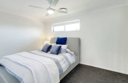 Charmhaven House | Welcome to your brand new stunning townhouse located in the Central Coast!