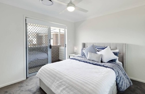 Charmhaven House | Welcome to your brand new stunning townhouse located in the Central Coast!