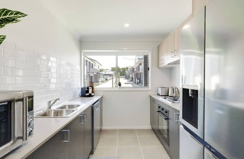 Charmhaven House | Welcome to your brand new stunning townhouse located in the Central Coast!