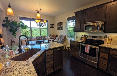 Leander House | Welcoming home overlooking lake with forested hill country views